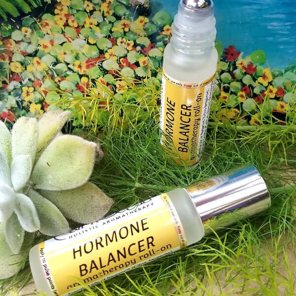 HORMONE BALANCER essential oil roll-on for PMS and menopause relief, featuring natural ingredients and a stylish design.