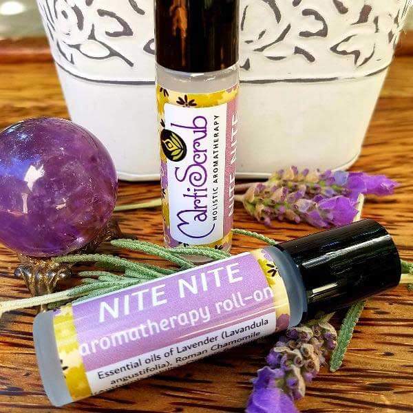 NITE NITE calming essential oil roll-on with lavender and chamomile, designed for restful sleep, displayed with herbal accents.