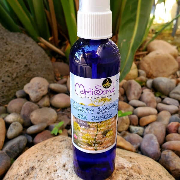 Sea Breeze Room Spray in blue bottle with herbal aroma, featuring essential oils and rose scent, ideal for any room.