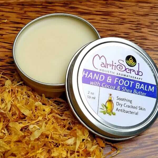 Moisturizing hand and foot balm in tin, surrounded by dried calendula petals, ideal for soothing dry cracked skin.