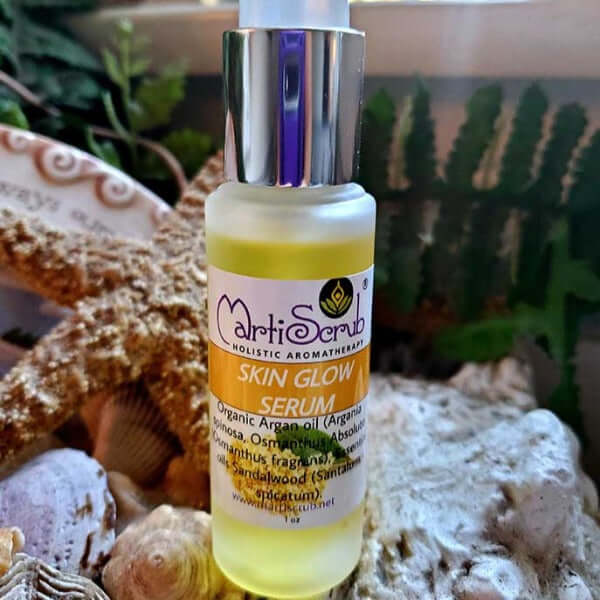MartiScrub Skin Glow Serum bottle with organic ingredients for skin rejuvenation and anti-aging benefits.
